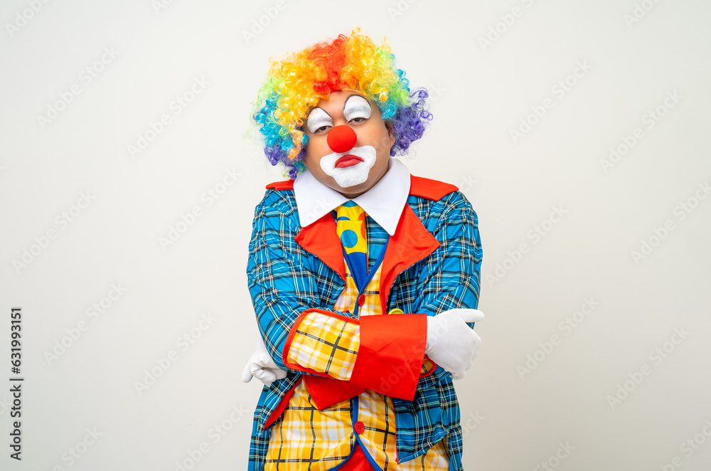 Mr Clown. Portrait of sadness face Clown man in colorful uniform standing crying feeling sad emotional. Expression male bozo in various pose on isolated background.