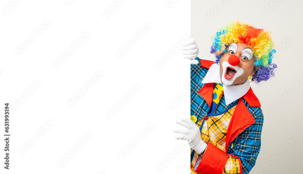 Mr Clown. Portrait of Funny face Clown man in colorful uniform standing holding copy space. Happy expression male bozo in various pose with frame mockup blank space on isolated background.