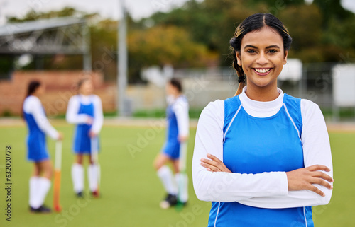 Field hockey woman, portrait and smile for sports, leadership and team at training for competition. Girl, athlete and outdoor with pride for fitness, workout or exercise with happy for development © Malik E/peopleimages.com