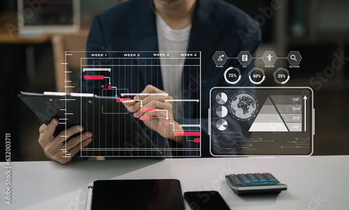 Project manager working and update tasks with milestones progress planning and professional investor working new start up project in the office.