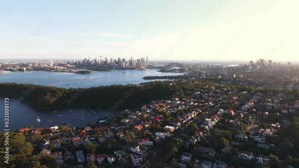 Drone aerial point of view cityscape skyline with skyscrapers office building and village community people house with sydney harbour bridge in NSW, Australia. Landmark famous place and tourism concept