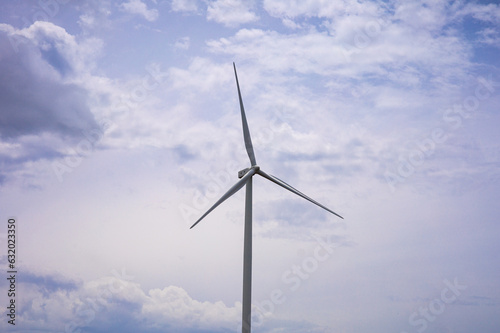 Wind Turbine Behind the beautiful blue sky