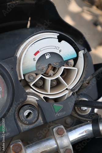 A closeup look broken motorcycle flue meter black color