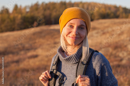 Middle Aged Woman Hiking and going Camping in nature photo