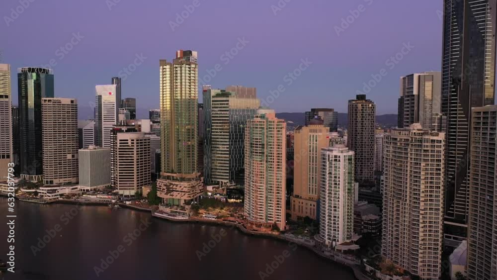 Aerial drone pullback reverse view over Story Bridge in Brisbane City, QLD, Australia along Brisbane River looking toward the east facing side of the city during the early morning in August 2023 Aerial drone pullback reverse view over Story Bridge in Brisbane City, QLD, Australia along Brisbane River looking toward the east facing side of the city during the early morning in August 2023