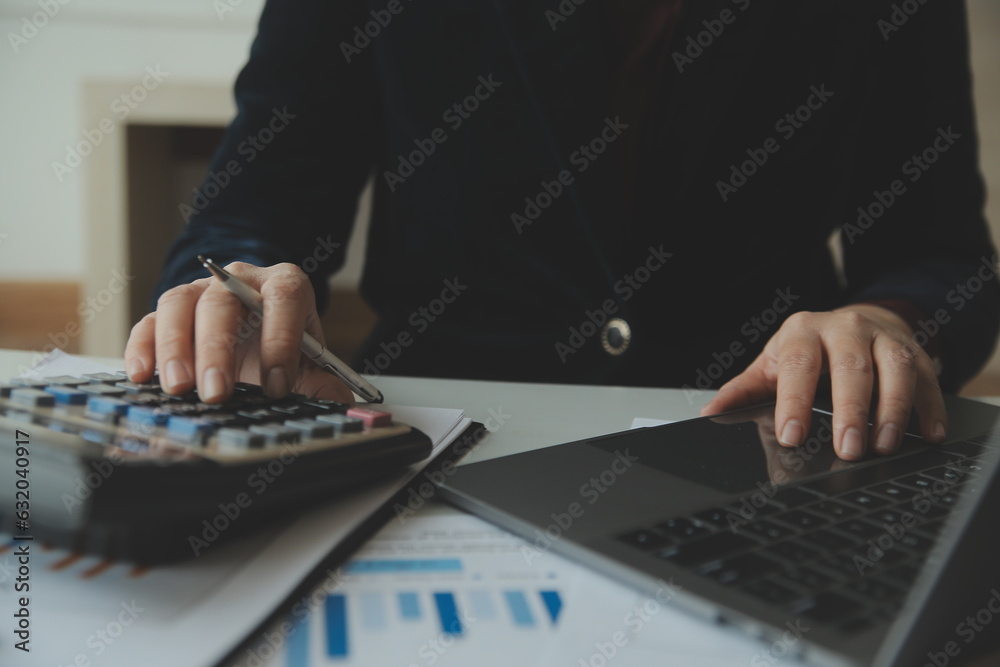 Unrecognizable businessman using calculator Unrecognizable businessman using calculator