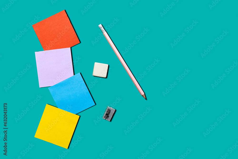 colored sheets to write on a blue background, with copy space, back to school colored sheets to write on a blue background, with copy space, back to school