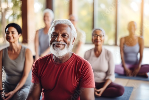A group of diverse old athletic retirees in tracksuits doing yoga in a yoga class at a retreat center