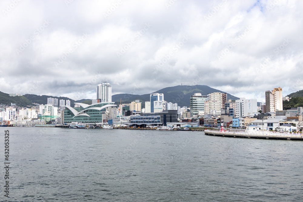Naklejka premium Busan, a large port city in South Korea, is known for its beaches, mountains and temples.