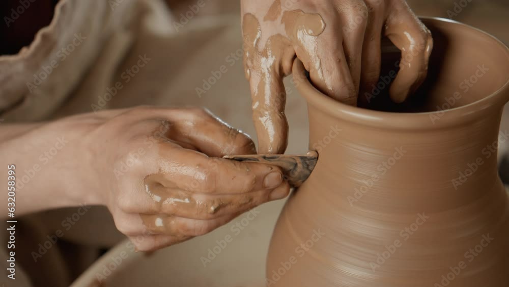 Man works with clay. Working process in ceramic workshop. Potter making vase on pottery wheel. Handmade concept. Close-up in 4K, UHD Man works with clay. Working process in ceramic workshop. Potter making vase on pottery wheel. Handmade concept. Close-up in 4K, UHD