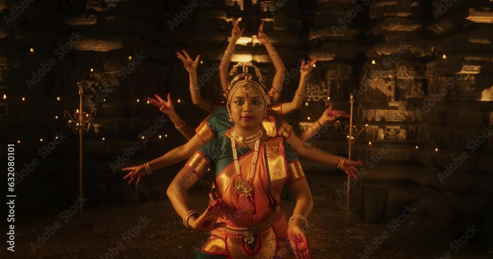 Slow Motion Portrait of CInematic Group of Indian Women Joyfully Dancing Traditional Folk Dance Outside of Authentic Temple. Colorful and Captivating South Asian Cultural Celebration. Zoom out
