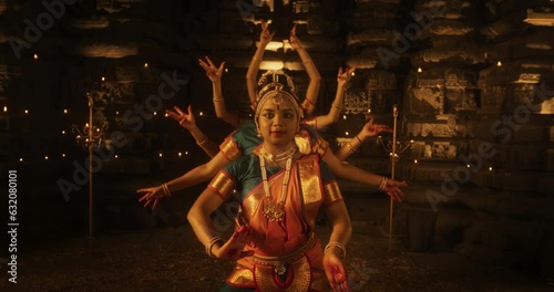 Slow Motion Portrait of CInematic Group of Indian Women Joyfully Dancing Traditional Folk Dance Outside of Authentic Temple. Colorful and Captivating South Asian Cultural Celebration. Zoom out