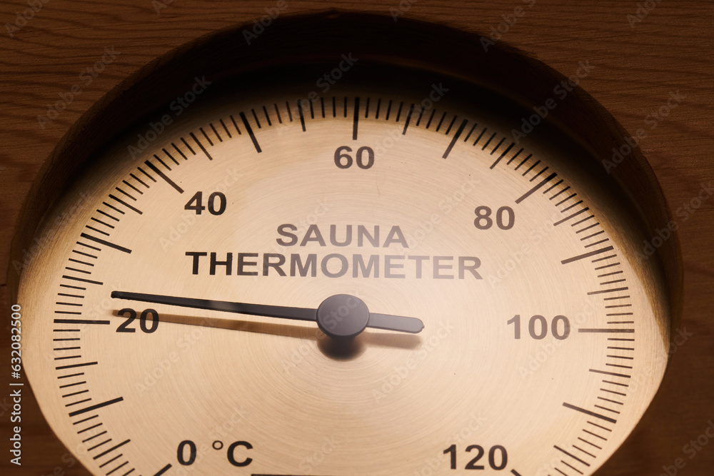Sauna thermometer made of wood closeup Sauna thermometer made of wood closeup