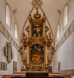 gigant altarpiece with a painting of the Last Supper and the crucifixion