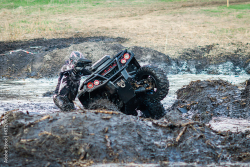 Fototapeta Naklejka Na Ścianę i Meble -  ATV, UTV, buggy, 4x4 off-road vehicle in muddy water. Extreme, adrenalin