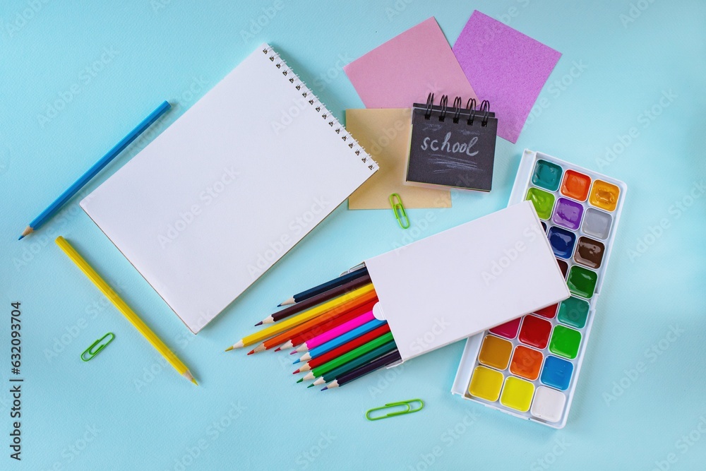 School supplies on a light blue background. Back to school concept, flat lay School supplies on a light blue background. Back to school concept, flat lay