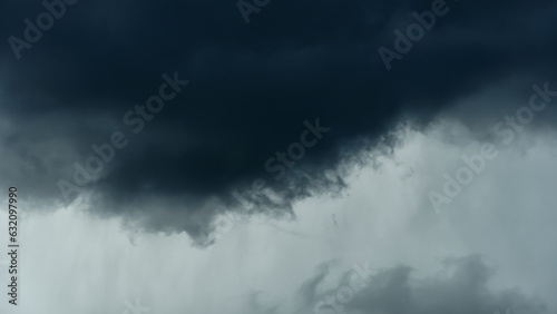 storm sky, dark dramatic clouds during thunderstorm, rain and wind, extreme weather, abstract background © soleg