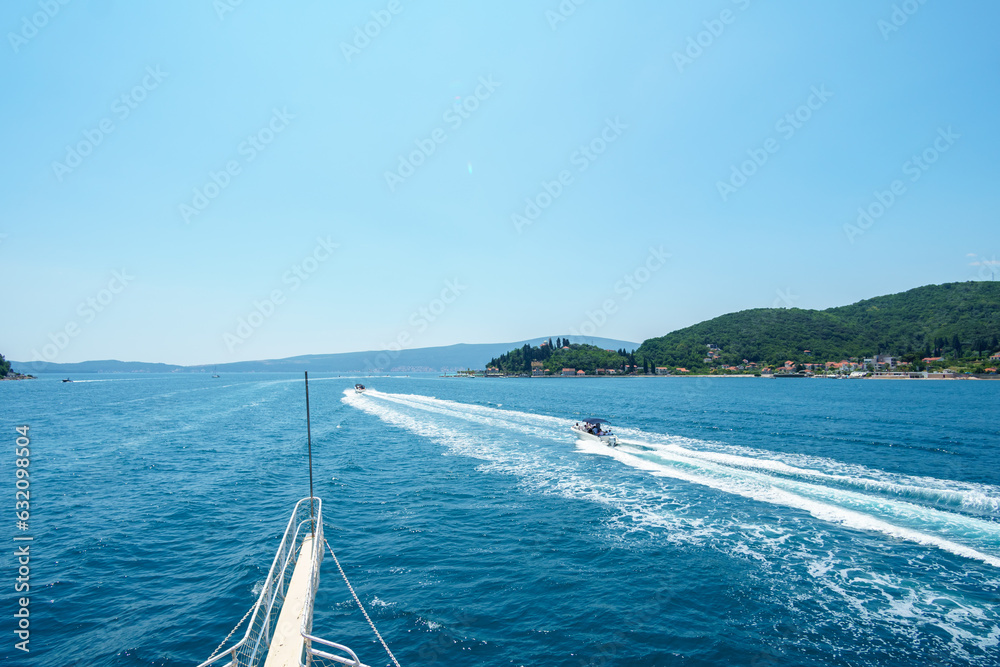 Obraz premium sea cruise with a view of the Bay of Kotor in Montenegro, beautiful views of nature and mountains, occasional yachts, travel