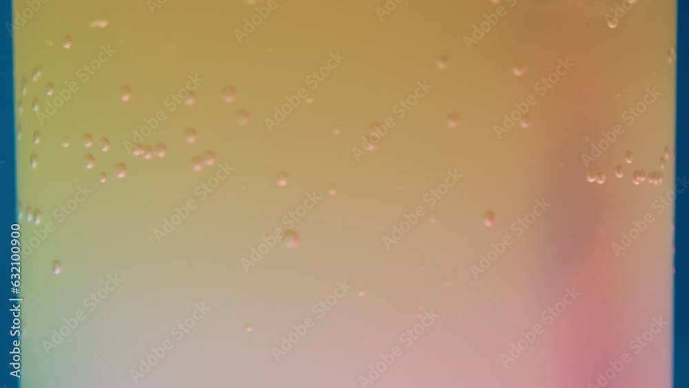 Experience the sensory delight of Macro Orange carbonated soda in this captivating video. Marvel at the play of bubbles as they swirl within the glass, stirred by a striped straw. The mist-kissed Experience the sensory delight of Macro Orange carbonated soda in this captivating video. Marvel at the play of bubbles as they swirl within the glass, stirred by a striped straw. The mist-kissed