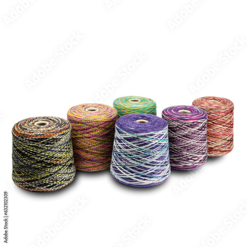 composition of bobbins with woolen threads, yarn for knitting close-up on a white background