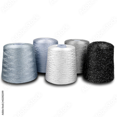 composition of bobbins with woolen threads, yarn for knitting close-up on a white background