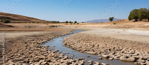 The riverbed of the Pinios, one of the longest rivers in Thessalia, Greece, is now dry due to heat and drought caused by climate warming. This could have potential consequences. The landscape is photo