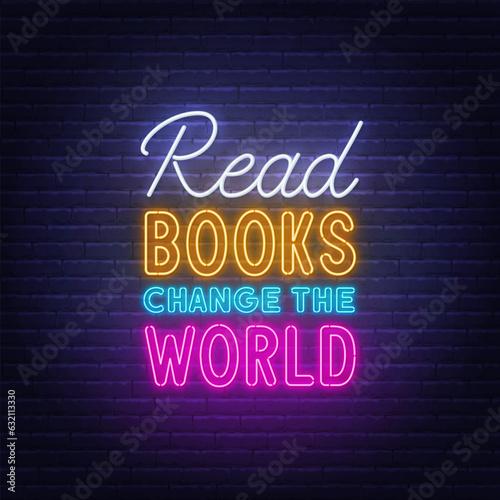 Read Books Change the World neon lettering on brick wall background.neon lettering on brick wall background.