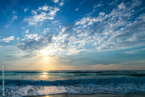 Beautiful cloudy sky at sunset. Seaside.