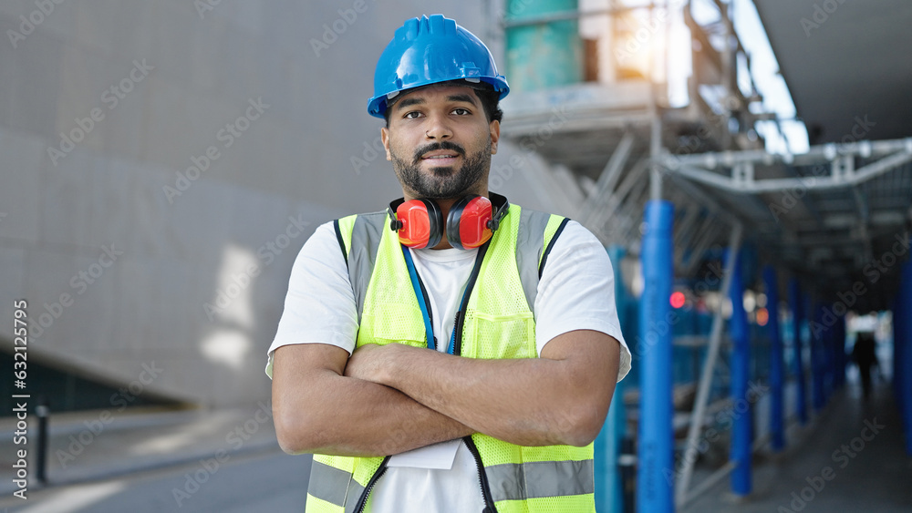 African american man builder standing with relaxed expression and arms crossed gesture at street African american man builder standing with relaxed expression and arms crossed gesture at street