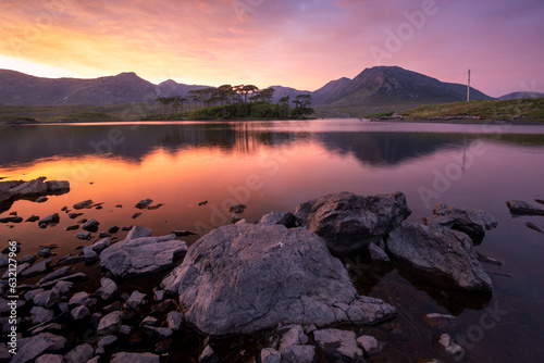Landscape. Mountains of Connemara National Park from Derryclare lough at sunset. Galway. Ireland photo