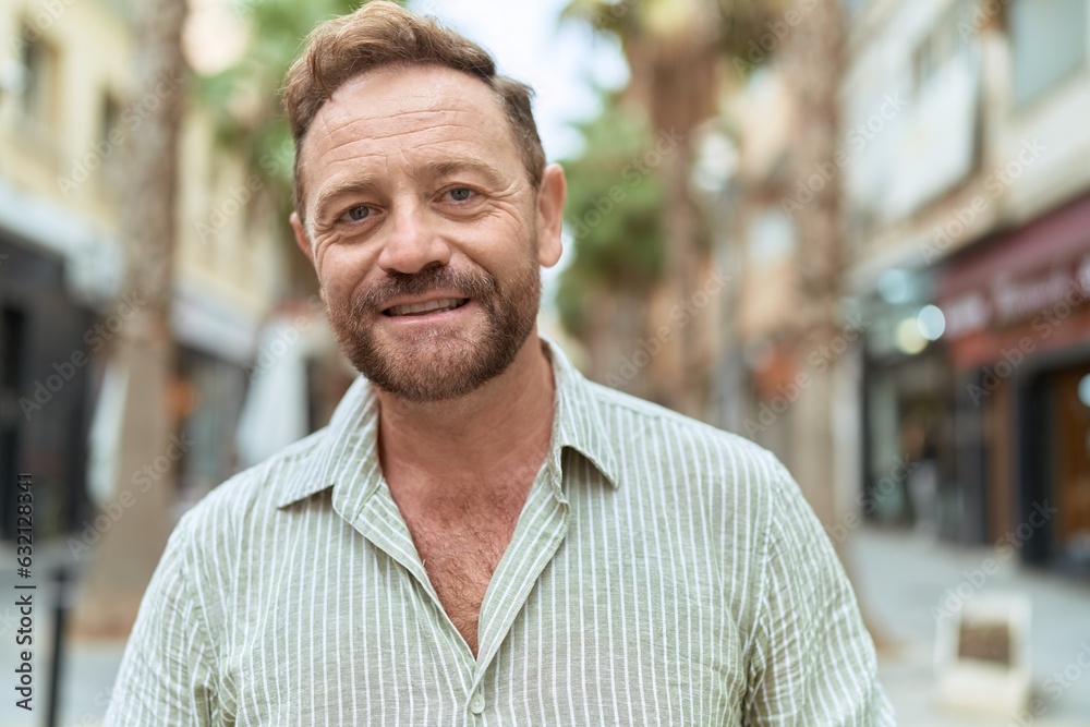 Middle age man smiling confident standing at street Middle age man smiling confident standing at street