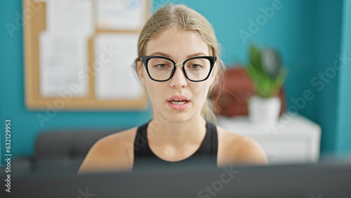 Young blonde woman business worker having video call at the office