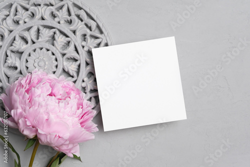 Square paper card mockup with flowers decor, blank card mock up with copy space