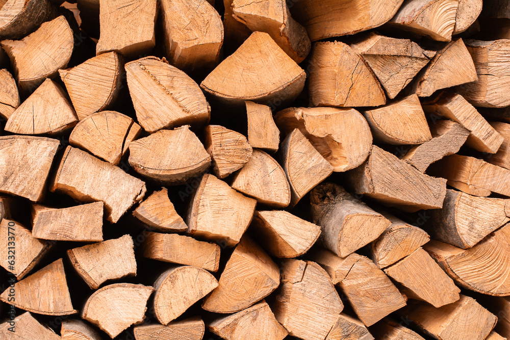 Textured firewood background, stack of chopped wood