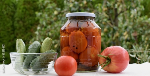 Salted tomatoes in a glass jar
