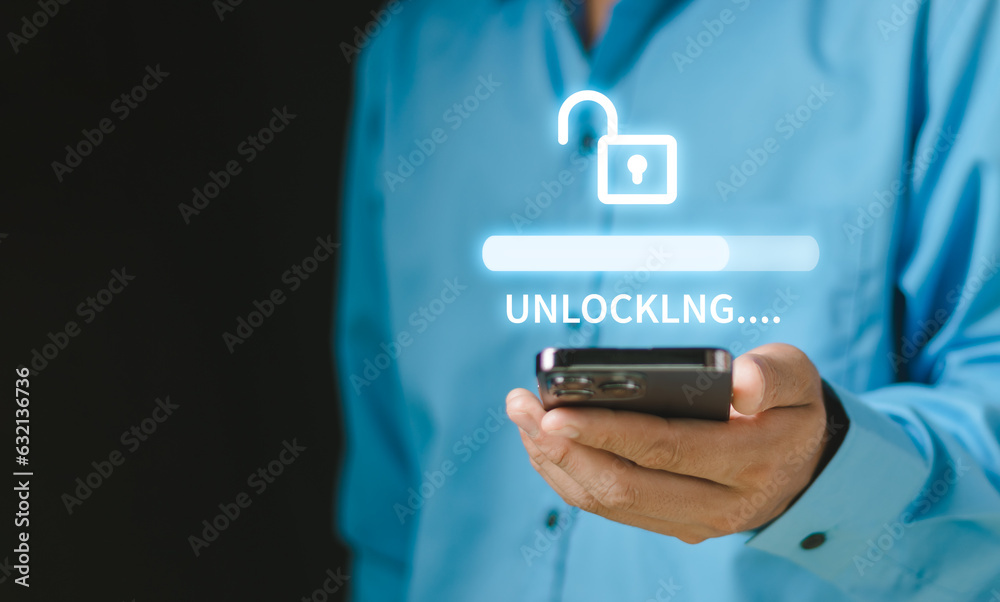 Businessman holding a smartphone unlock success idea, creativity concept, Hand holding unlock virtual icon graphic Business innovation and technology concept..