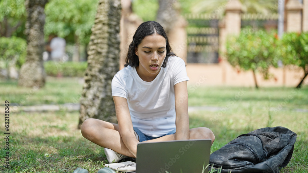 African american woman student using laptop studying at university campus African american woman student using laptop studying at university campus