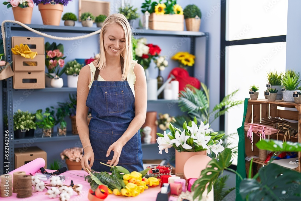Young blonde woman florist make bouquet of flowers at florist store Young blonde woman florist make bouquet of flowers at florist store