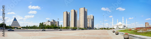 Panorama of Astana city center: Tauelsizdik Avenue, Independence Square, Palace of Peace and Accord, Hazret Sultan Mosque on a sunny summer day. 