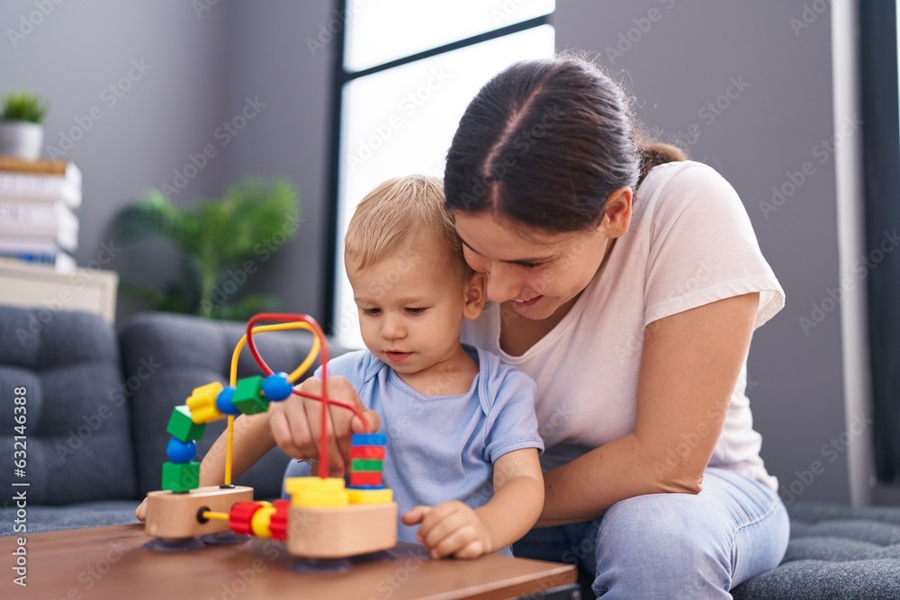 Mother and son smiling confident playing at home Mother and son smiling confident playing at home