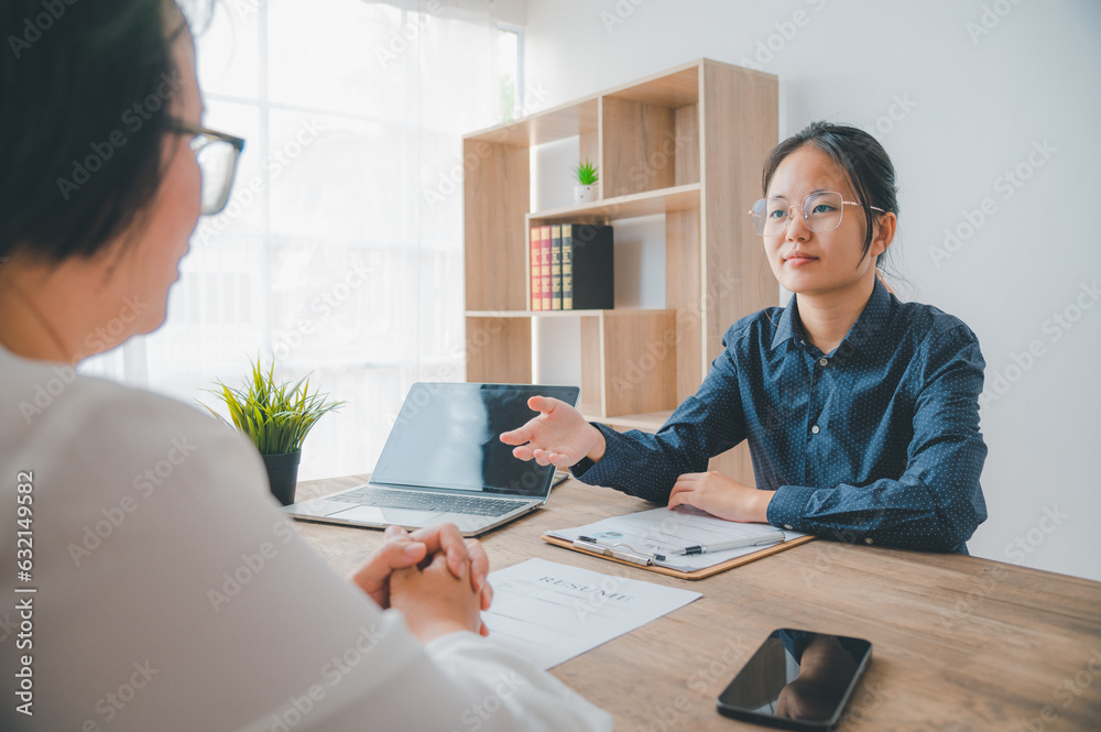 HR managers are interviewing job applicants who fill out their resume on the job application form in order to consider accepting a job as a company HR managers are interviewing job applicants who fill out their resume on the job application form in order to consider accepting a job as a company