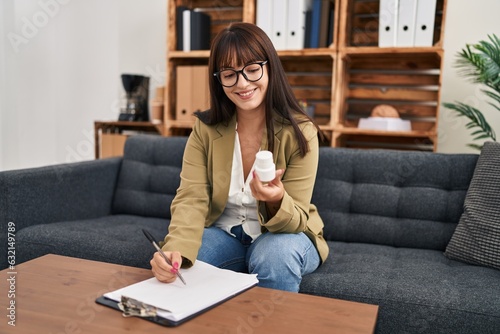 Free Download Young beautiful hispanic woman psychologist prescribe pills treatment at psychology clinic - GFXLoad