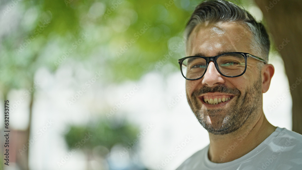 Grey-haired man smiling confident standing at park Grey-haired man smiling confident standing at park