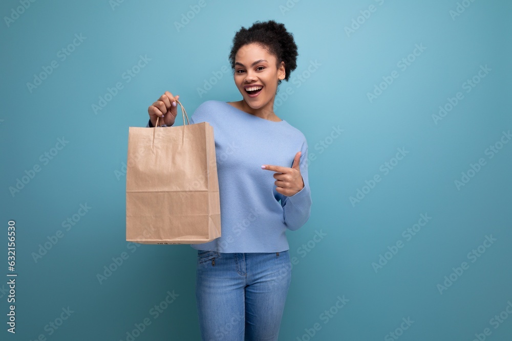 happy young brunette latin woman holding eco vegan craft package happy young brunette latin woman holding eco vegan craft package