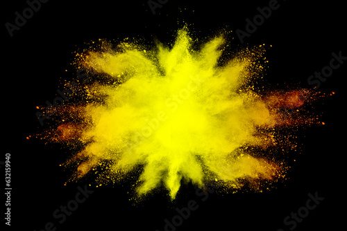 abstract powder splatted background. yellow powder explosion on black background. Colored cloud. Colorful dust explode. Paint Holi