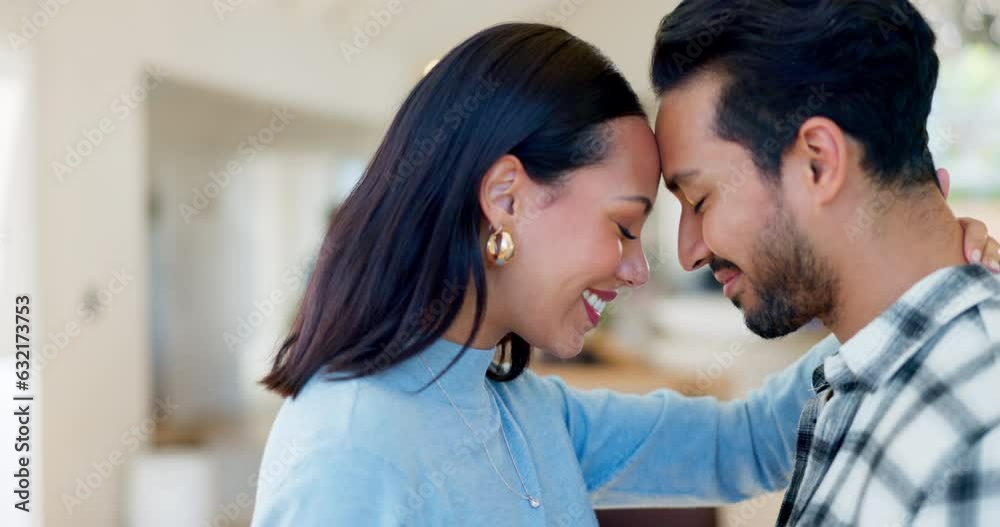 Happy couple, forehead and embrace for love, care or compassion together in new home or property. Man and woman smile for loving relationship, commitment and touching heads for romance in the house Happy couple, forehead and embrace for love, care or compassion together in new home or property. Man and woman smile for loving relationship, commitment and touching heads for romance in the house