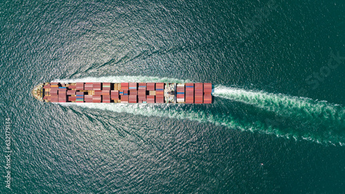 cargo container ship sailing full speed in sea to import export goods and distributing products to dealer and consumers worldwide, by container ship Transport business delivery service, aerial view