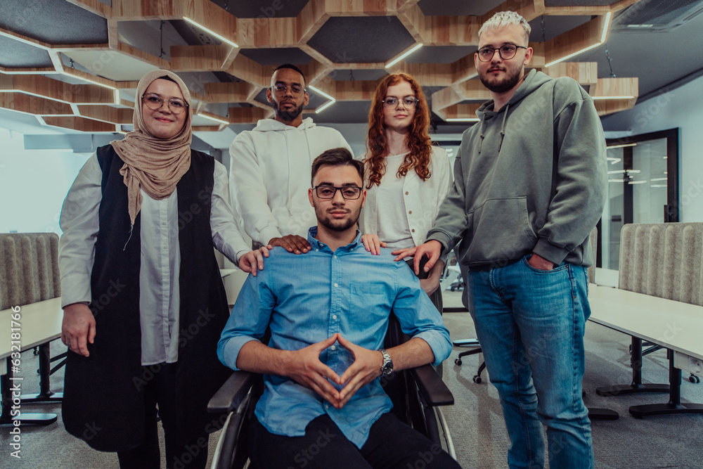 Young businessmen in a modern office extend a handshake to their business colleague in a wheelchair, showcasing inclusivity, support, and unity in the corporate environment.