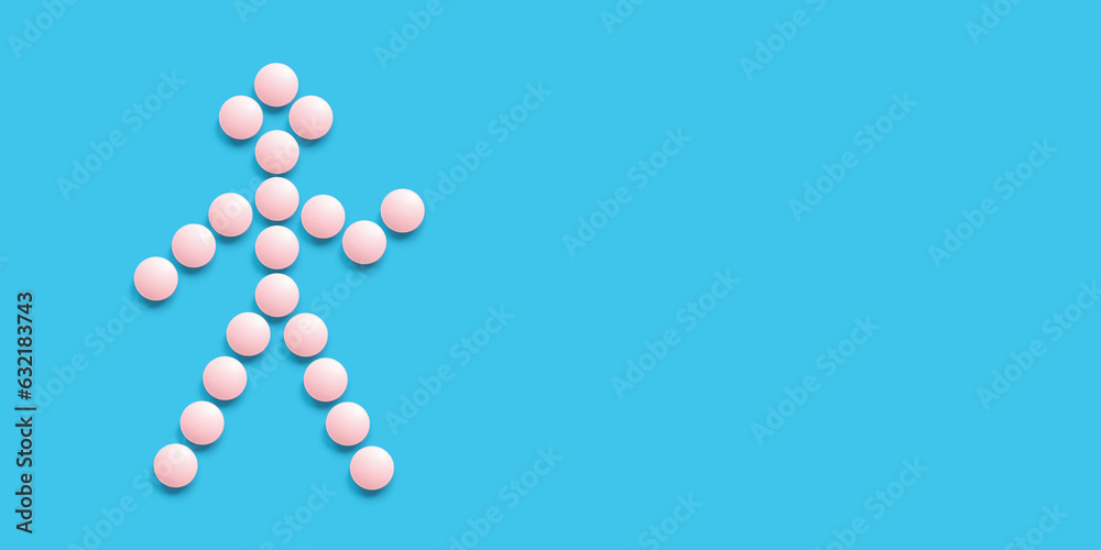 A little man lined with pink pills on a blue background, top view. Health care, medical pills and nutritional supplements. Pharmaceuticals and drug abuse A little man lined with pink pills on a blue background, top view. Health care, medical pills and nutritional supplements. Pharmaceuticals and drug abuse