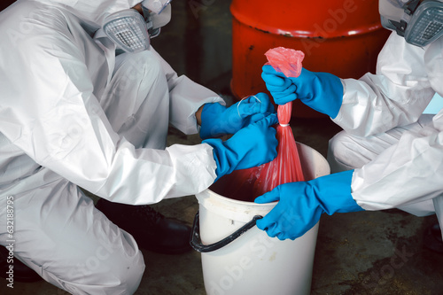 Keep Chemicals in Toxic Waste Red Bag and Thick Plastic Barrels for Disposal, Dispose of Material Safely. Clean up Chemical Liquid Spill. Part of Basic Practical Training for Chemical Spill.
